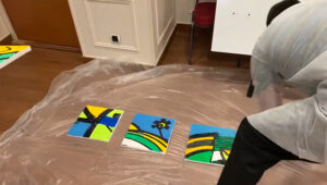Des toiles de la fresque puzzle en Team Building Peinture My Art Box à Grenoble recomposées par les équipes avant exposition