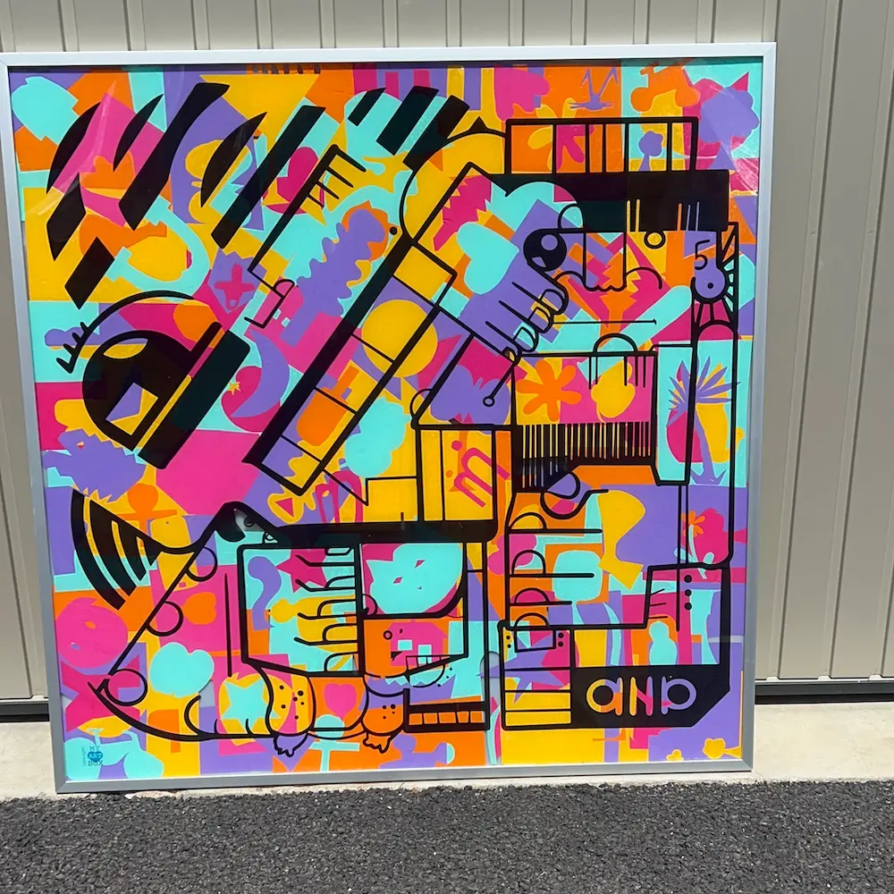 Œuvre collaborative colorée réalisée lors d’une animation RSE pour inauguration immobilière, encadrée et prête à être exposée