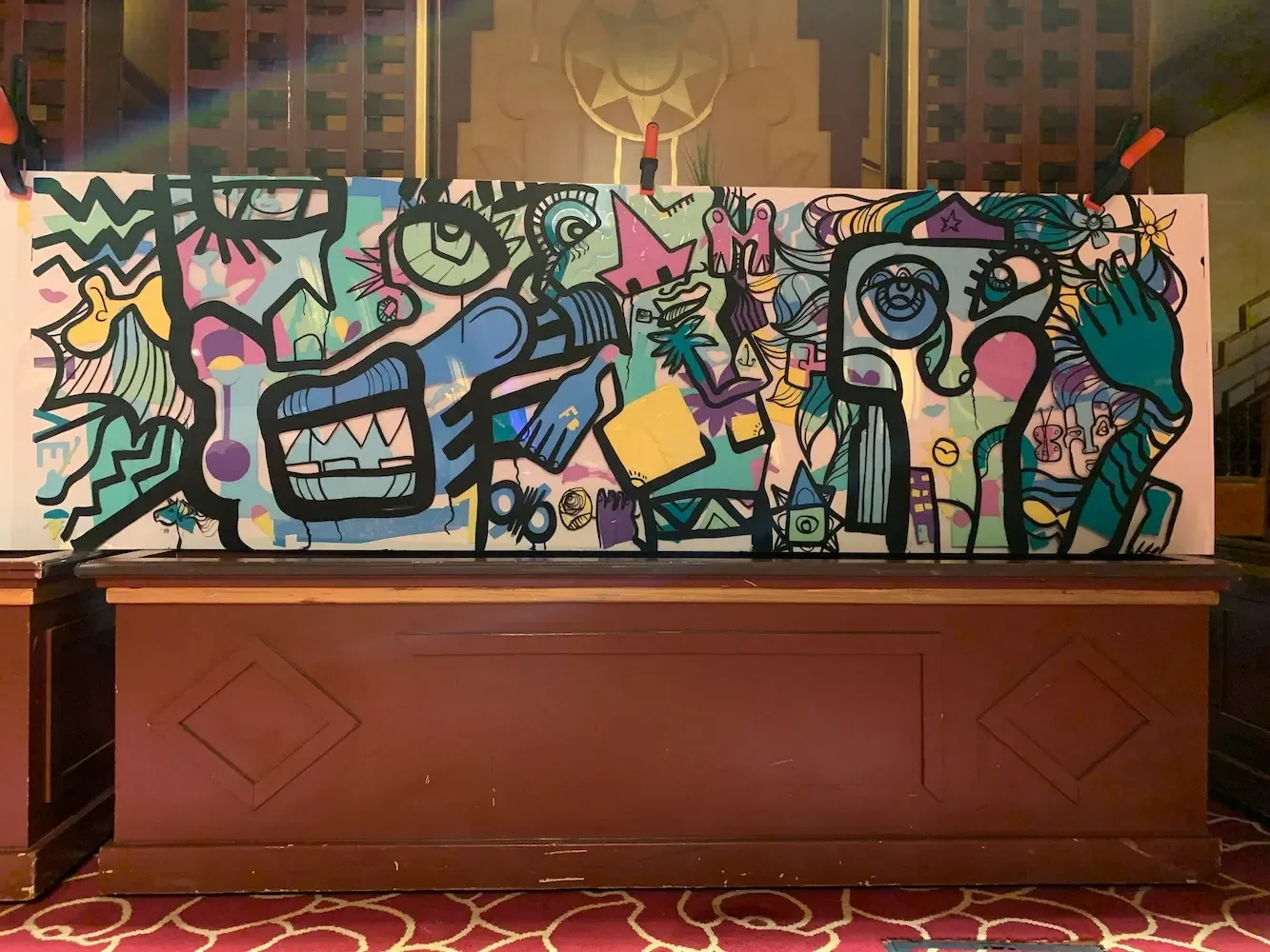 Tableau coloré avec la ligne noire de Ana, idées découpées par les participants à Divonne, dans le cadre d'une animation anniversaire 60 ans.