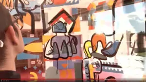 aNa artiste en train de réaliser une Fresque art box animation centre de formation à Lyon