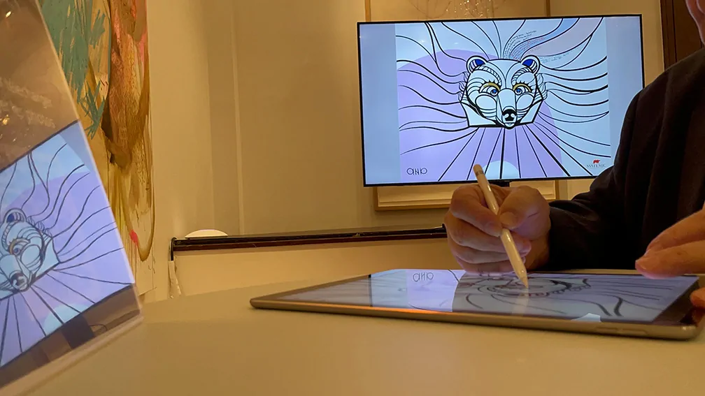 La fresque digitale livre d'or artistique en cours de création et projetée en direct sur un écran