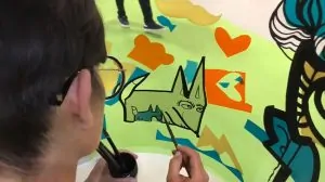 L'artiste aNa crée une fresque QVT par jour sur la salon Préventica à Paris